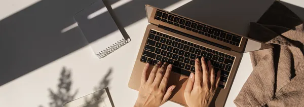 Laptop screen showing Noir Canva template in use